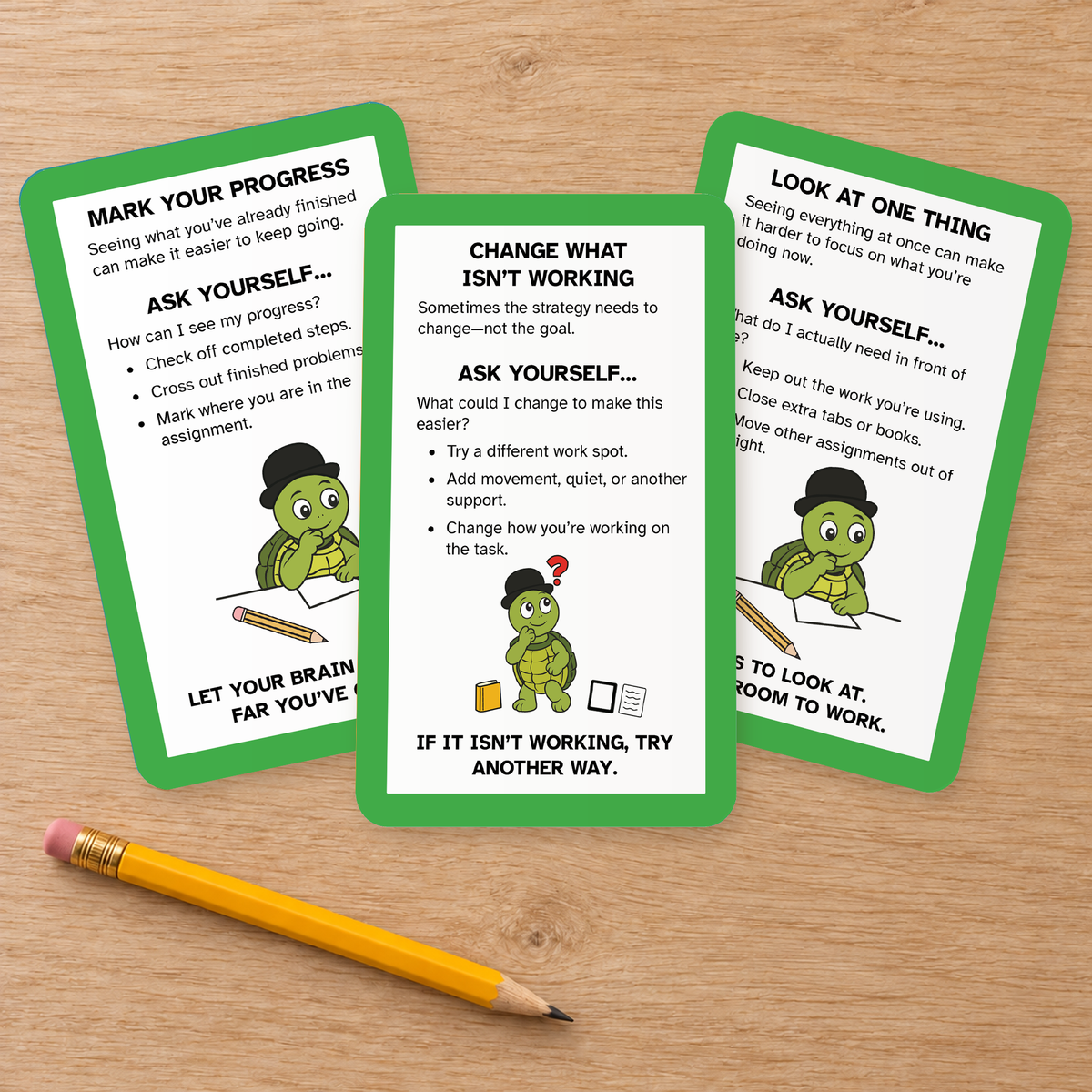 Three Homework Completion strategy cards fanned on a wooden table beside a pencil.