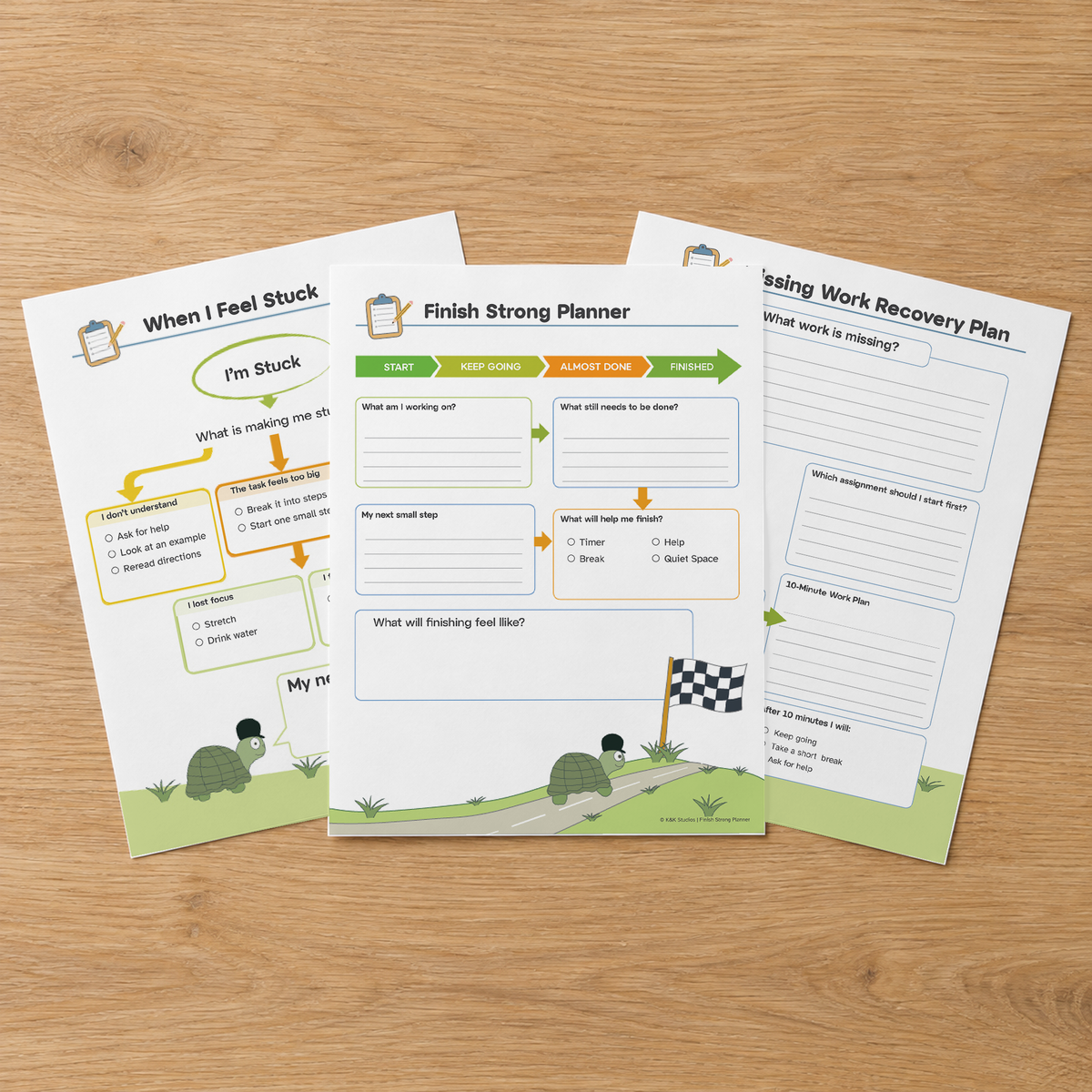 Three task completion resource pages fanned on a wooden table.