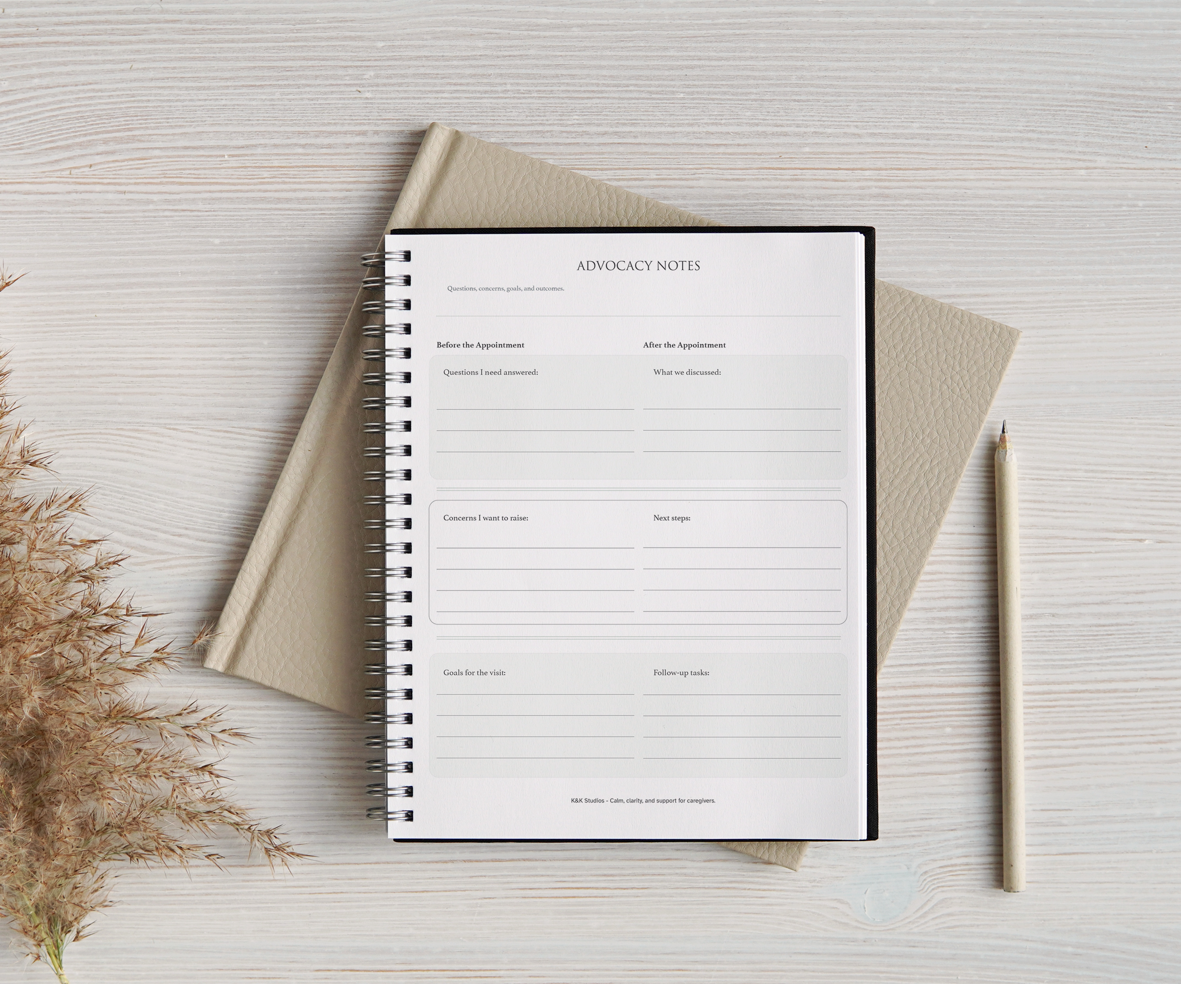 Notebook with a blank page on a light wooden surface with a pencil and dried plants.