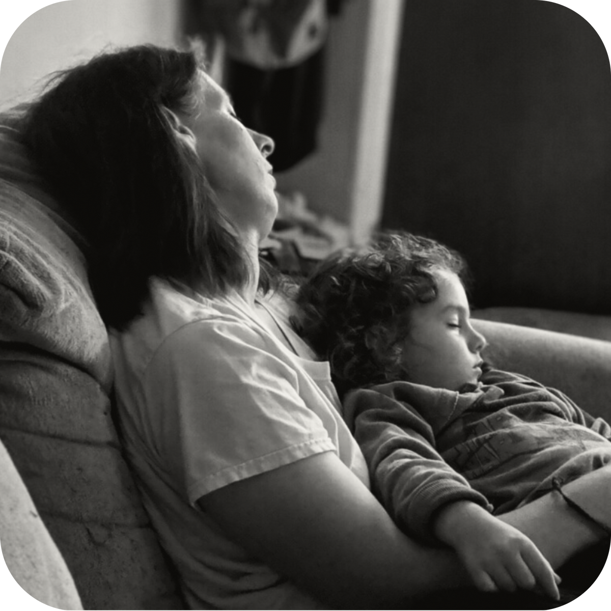 Kary and her son resting together on a couch.