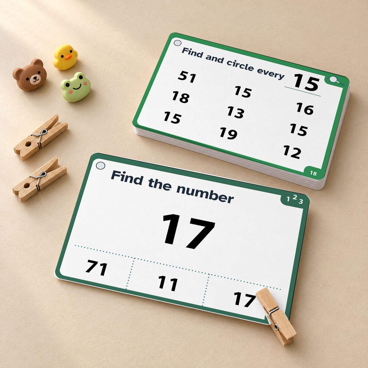 Two green and white educational math cards for children on a beige background, styled with small wooden clothespins and mini animal figurines.