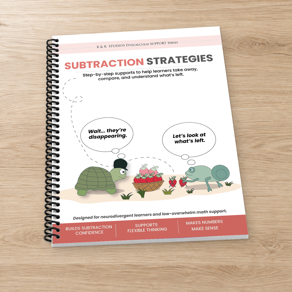 A spiral-bound workbook titled 'Subtraction Strategies' by K & K Studios Dyscalculia Support Series, displayed on a light wood background. The cover features cartoon illustrations of a turtle and a chameleon with speech bubbles.