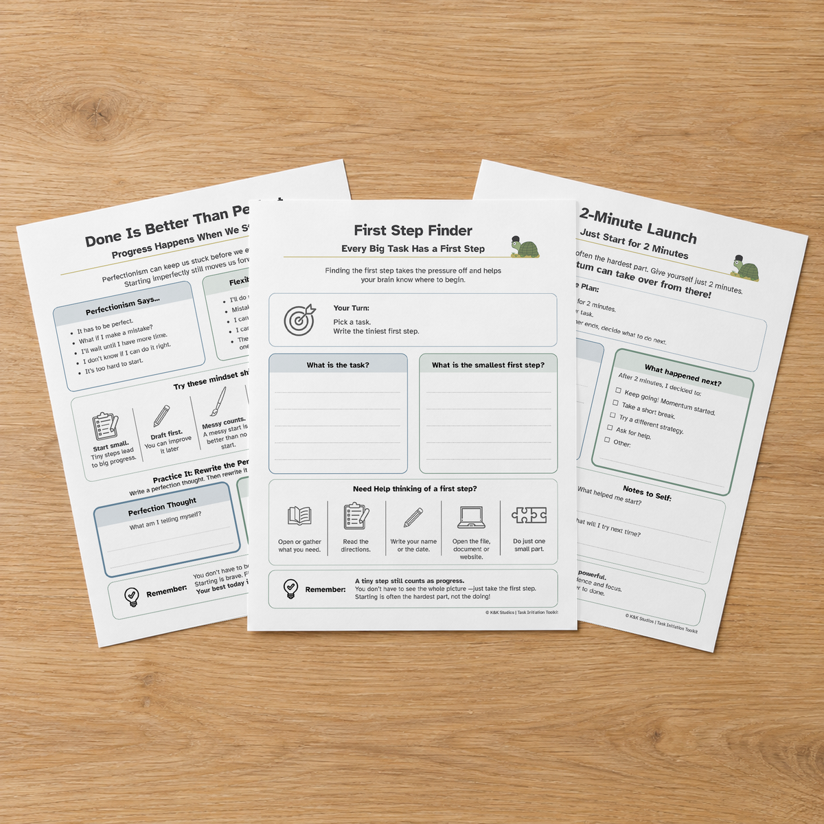Three Task Initiation planning and reflection pages fanned on a wooden table.