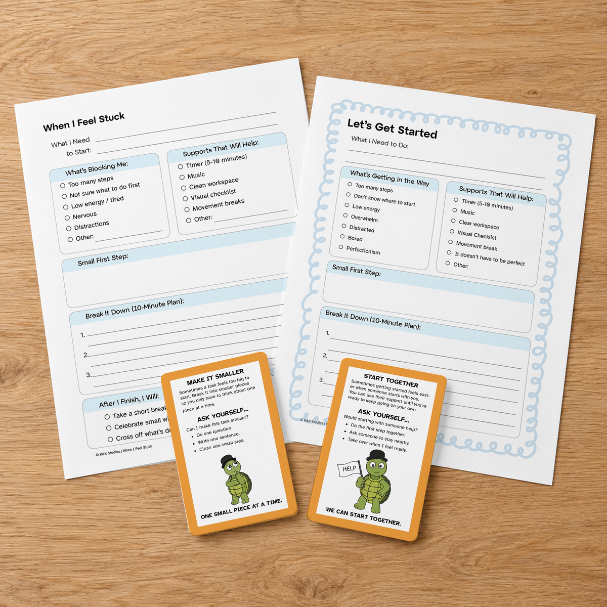 Task Initiation strategy cards and teacher-support pages arranged on a wooden table.